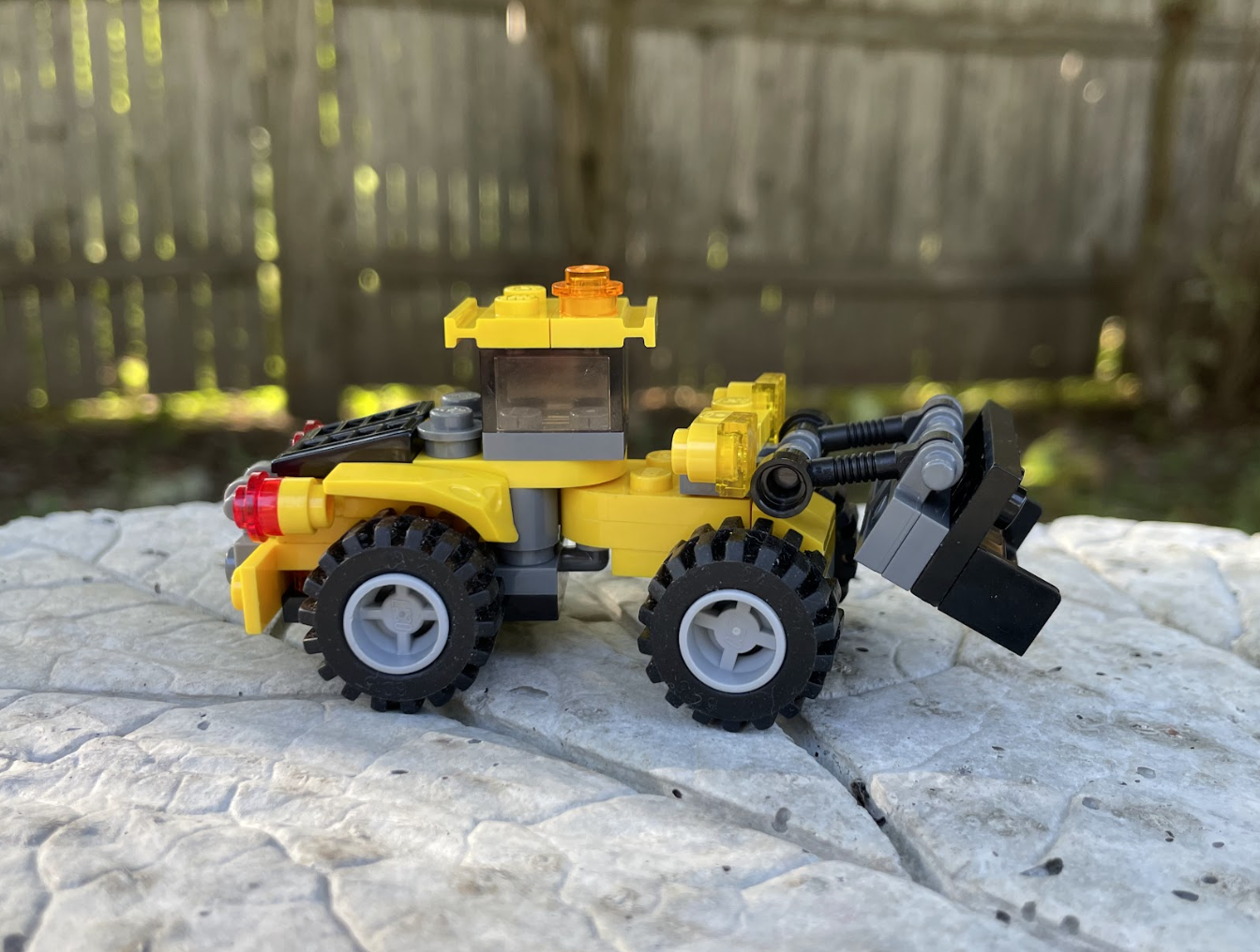 A yellow LEGO construction digger