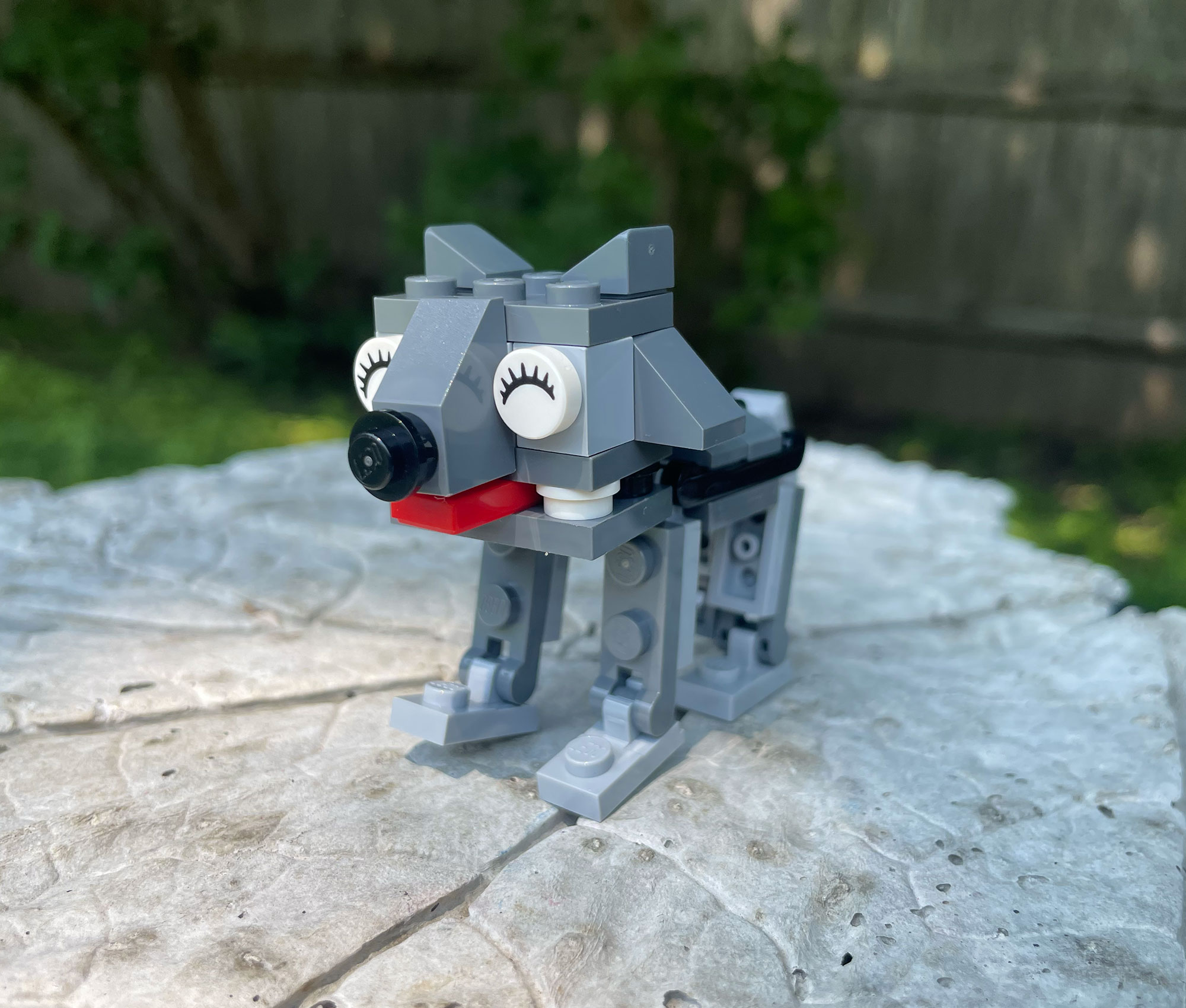 LEGO dog model with expressive features, created by students during Brick by Brick summer STEM camps focused on engineering and creativity.
