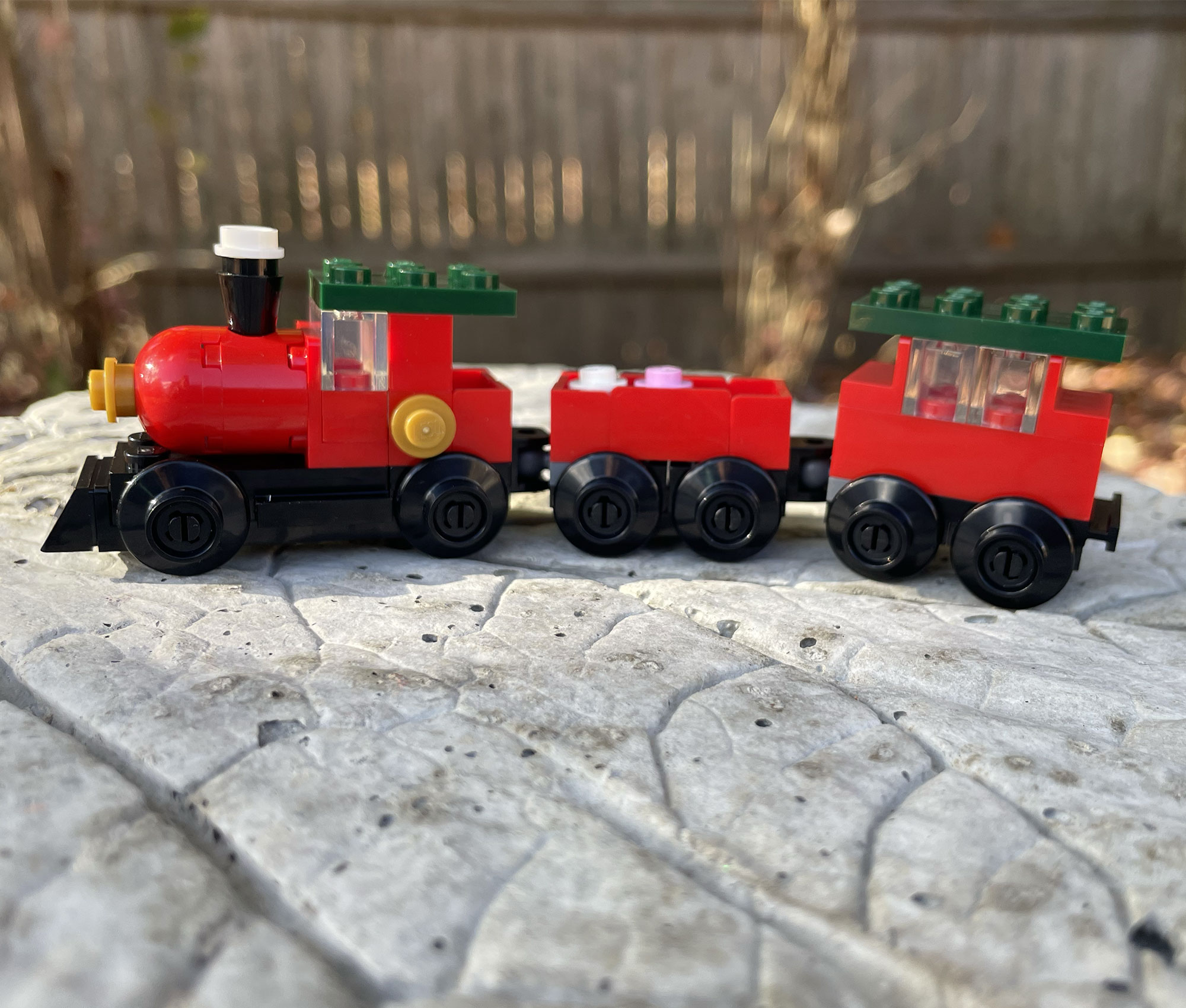 LEGO train with engine and cars, demonstrating sequencing, structure, and problem-solving taught in Brick by Brick LEGO STEM classes.